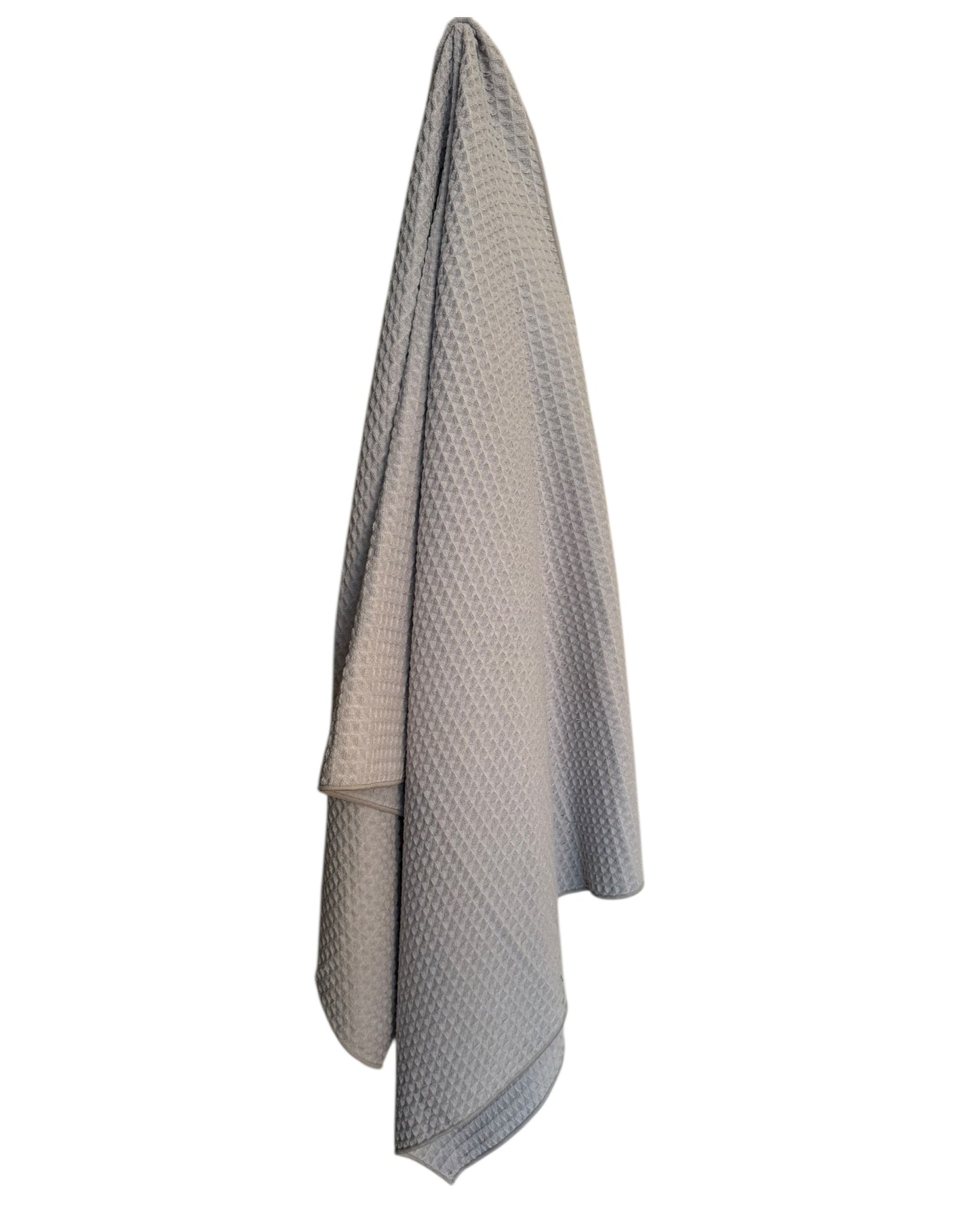 Textured gray towel hanging on a white background