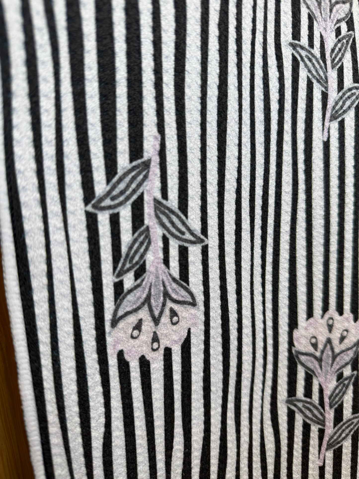 Black and white striped fabric with floral patterns
