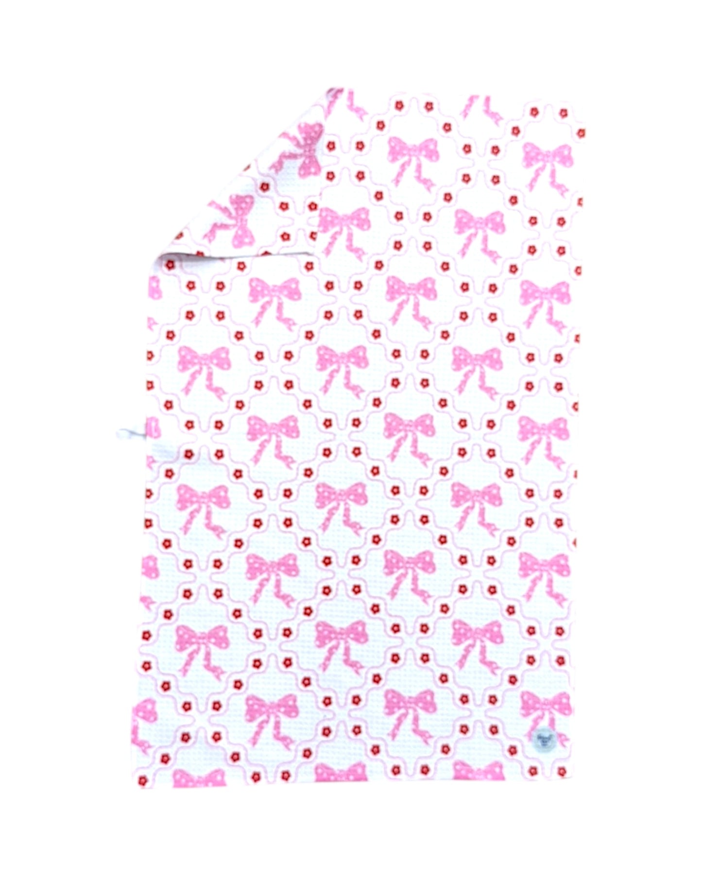 dish towel with pink bow and dot pattern on a white background