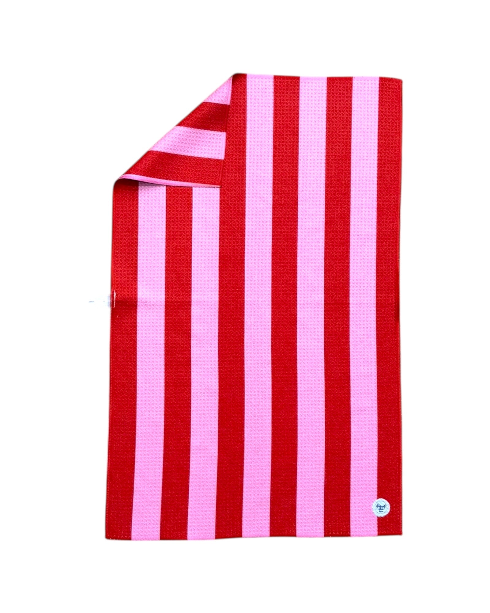 Red and pink striped towel on a white background