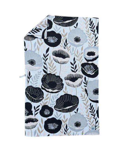 Floral patterned TOWEL with black and gray flowers on a white background