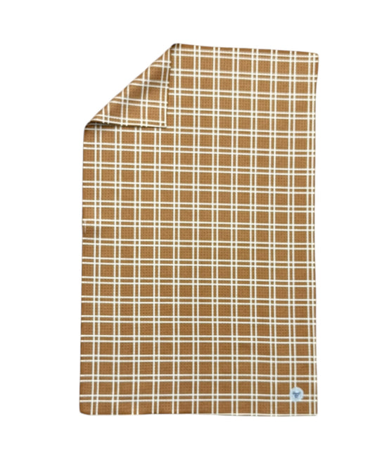 Plaid pattern TOWEL with a visible brand logo on a white background