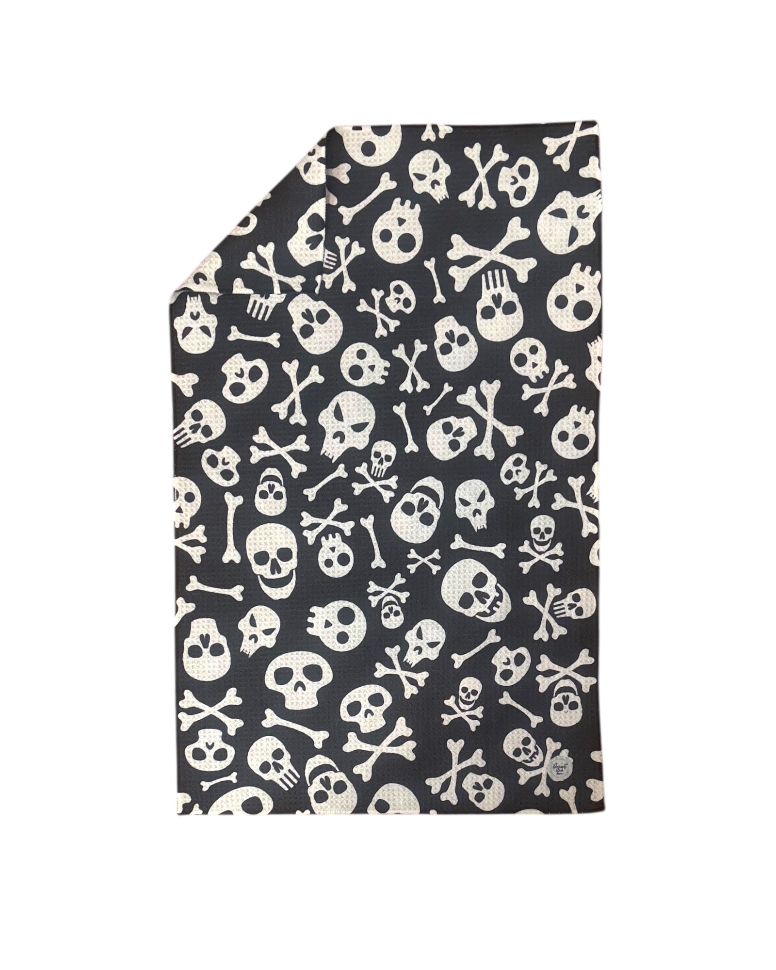 Folded dish towel with skull and crossbones pattern on a white background
