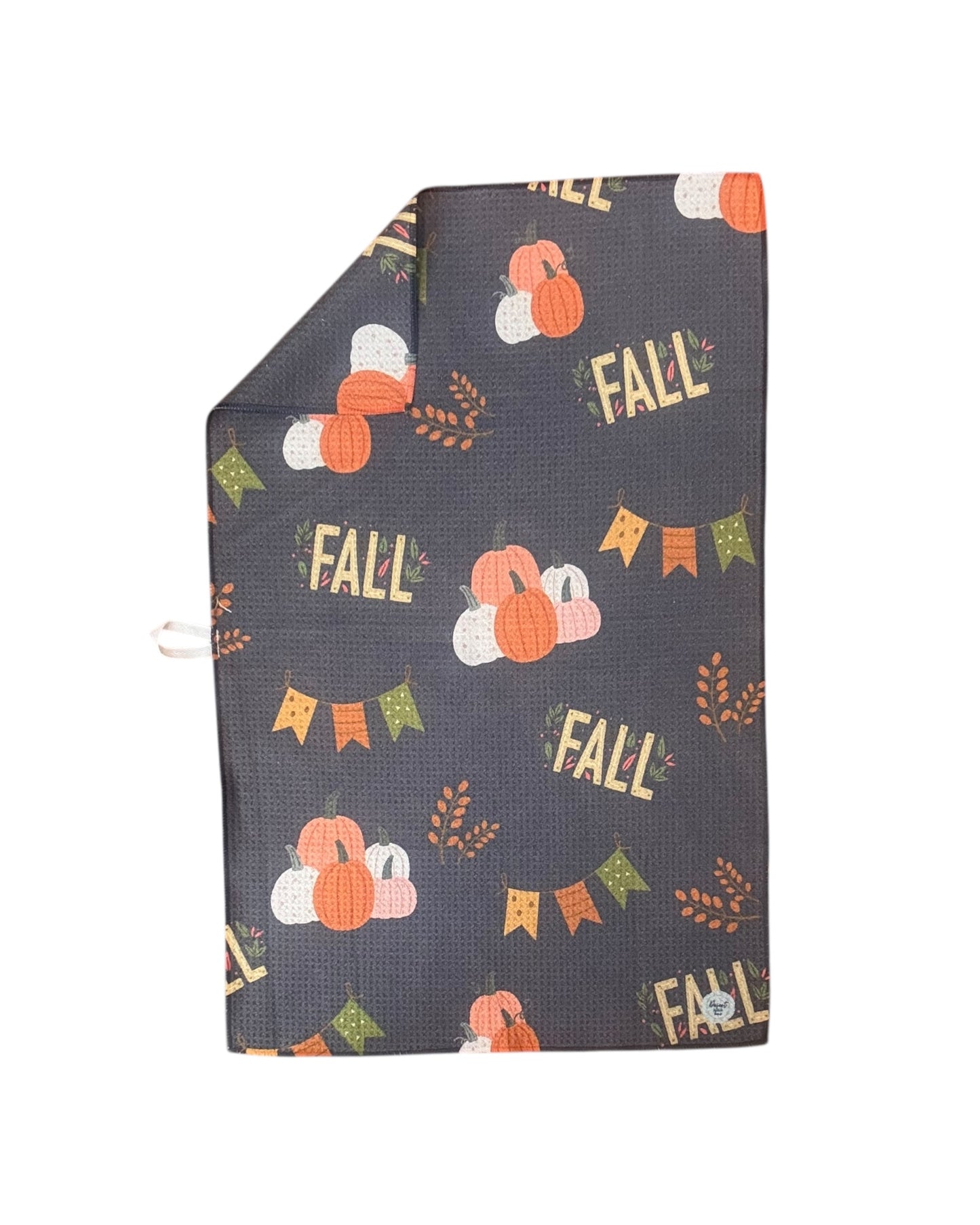 dish towel with 'Fall' and pumpkin patterns on a gray background