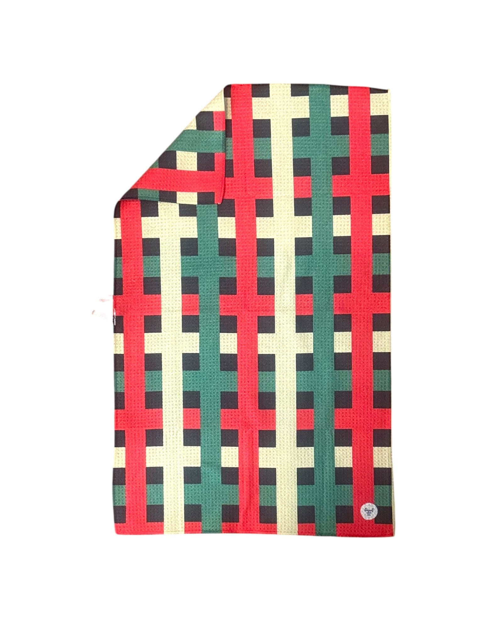 Plaid patterned towel with red, green, colors on a black background